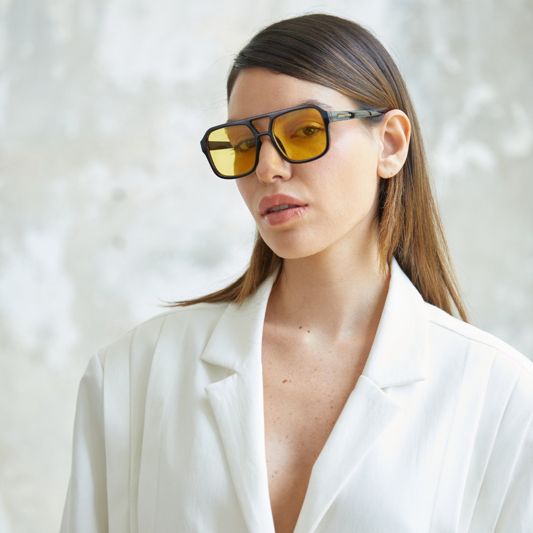 Model wearing ZAMOTHRA AURA sunglasses with yellow lenses