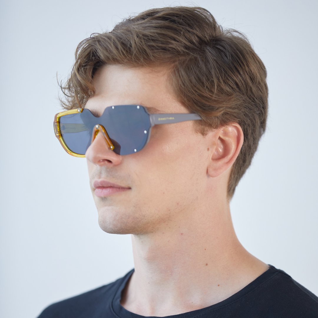 Man wearing CYBER / Solar Midnight sunglasses, three-quarter view